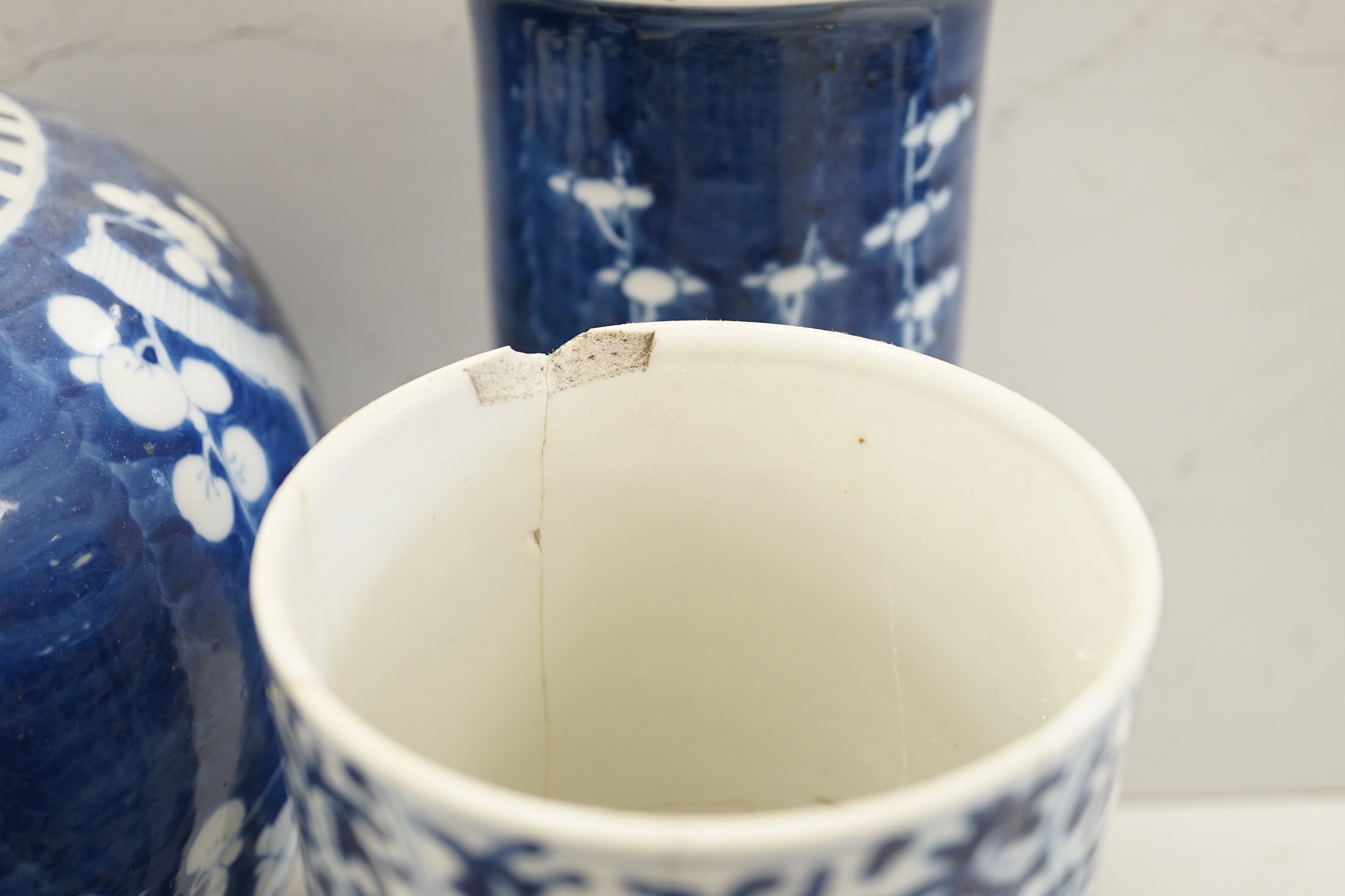 A Chinese blue and white Buddhist lion moon flask, a baluster vase, three sleeve vases and two others, 19th century, tallest 33cms (a.f.)